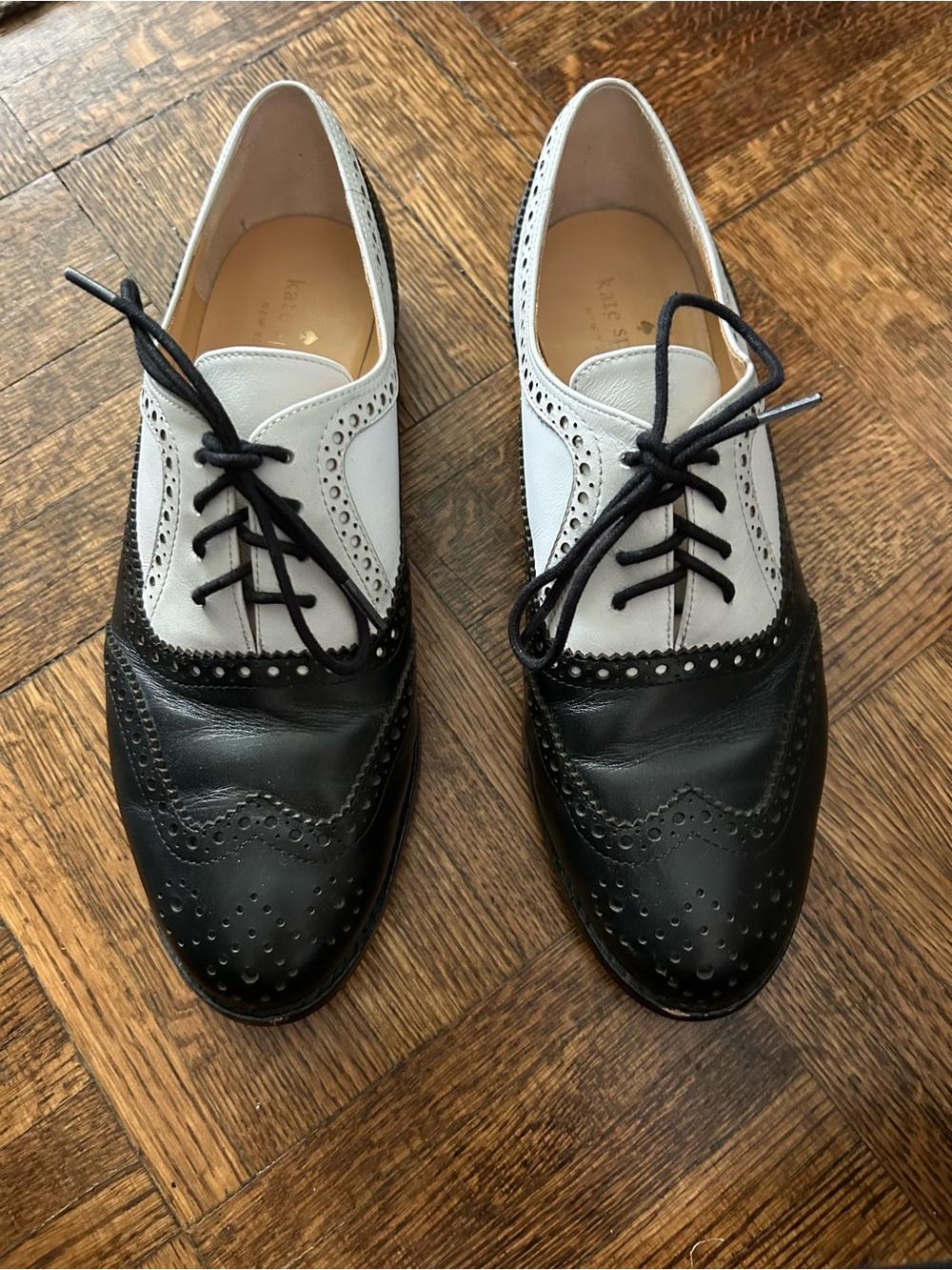 Kate Spade New York black and white spectator wingtip oxfords